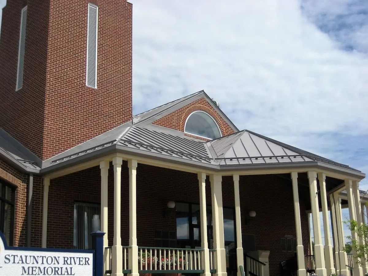 Skilled roofing craftsmen working on a residential roof in Hyndman